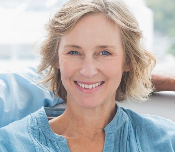 Man and woman sitting on couch with man